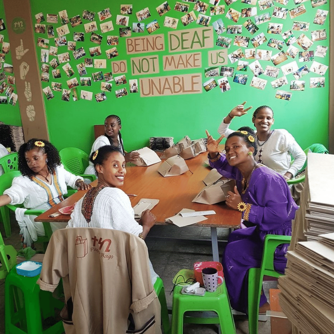 A picture of five Teki Paper Bags employees who are deaf and wearing traditional Ethiopian dress.